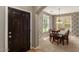 Dining area with table and chairs near entryway at 875 S Brewer Dr, Gilbert, AZ 85296