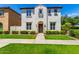 Two-story home with front yard landscaping and walkway at 875 S Brewer Dr, Gilbert, AZ 85296