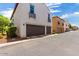 Attached garage with brown doors and exterior view at 875 S Brewer Dr, Gilbert, AZ 85296