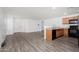 Kitchen with oak cabinets, black appliances, and laminate floor at 910 W Prior Ave, Coolidge, AZ 85128