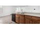 Kitchen featuring oak cabinets and a double sink at 910 W Prior Ave, Coolidge, AZ 85128