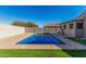 Refreshing rectangular pool with grassy backyard at 910 W Prior Ave, Coolidge, AZ 85128