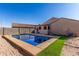 Sparkling blue rectangular pool in backyard oasis at 910 W Prior Ave, Coolidge, AZ 85128