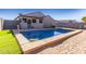 Inviting rectangular pool with surrounding sand and grass at 910 W Prior Ave, Coolidge, AZ 85128