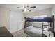 Bedroom with bunk beds and plenty of closet space at 9176 N 82Nd Ln, Peoria, AZ 85345