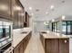 Modern kitchen with granite counters and dark cabinets at 925 E Piedmont Rd, Phoenix, AZ 85042