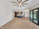 Open living room with kitchen view and tile floors at 925 E Piedmont Rd, Phoenix, AZ 85042