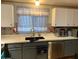 Kitchen with sink, dishwasher and cabinets at 9302 E Broadway Rd # 103, Mesa, AZ 85208