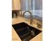 Modern kitchen sink with updated faucet and stylish countertops at 9302 E Broadway Rd # 103, Mesa, AZ 85208