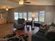 Spacious living room with large windows and wood-look flooring at 9302 E Broadway Rd # 103, Mesa, AZ 85208