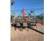 Outdoor tennis courts with seating area and shade umbrella at 9302 E Broadway Rd # 103, Mesa, AZ 85208