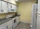 White kitchen with ample counter space and appliances at 945 N Pasadena St # 113, Mesa, AZ 85201