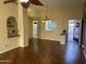 Bright living room with hardwood floors and access to kitchen at 945 N Pasadena St # 113, Mesa, AZ 85201