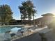 Community pool area with lounge chairs and a covered patio at 945 N Pasadena St # 113, Mesa, AZ 85201