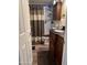 Bathroom with dark brown vanity, shower, and updated fixtures at 11596 W Sierra Dawn Blvd # 278, Surprise, AZ 85378