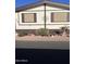 Mobile home exterior with landscaping and decorative accents at 11596 W Sierra Dawn Blvd # 278, Surprise, AZ 85378