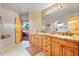 Double vanity bathroom with granite countertops at 12875 E Cochise Rd, Scottsdale, AZ 85259