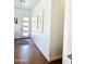 Bright entryway with wood floors and shiplap accent wall at 17234 N 28Th St, Phoenix, AZ 85032