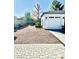 Landscaped front yard with gravel driveway and two-car garage at 17234 N 28Th St, Phoenix, AZ 85032