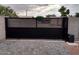 Modern black automatic gate adds privacy and security at 17234 N 28Th St, Phoenix, AZ 85032