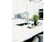 Modern kitchen with white cabinets and quartz countertops at 17234 N 28Th St, Phoenix, AZ 85032