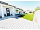 Landscaped side yard with artificial turf and pavers at 17234 N 28Th St, Phoenix, AZ 85032