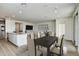 Open dining area with kitchen island and living room views at 18231 E Coronado Cave Ct, Rio Verde, AZ 85263