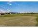 Golf course putting green with mountain view in the background at 18231 E Coronado Cave Ct, Rio Verde, AZ 85263