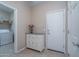 Convenient laundry room with storage cabinet at 19348 W Harrison St, Buckeye, AZ 85326