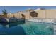 Luxury pool and spa with waterfall feature at 19348 W Harrison St, Buckeye, AZ 85326