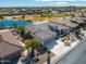 Single story home with tile roof and a three car garage at 20621 N Canyon Whisper Dr, Surprise, AZ 85387
