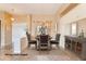 Formal dining room with a staged table and built-in hutch at 20621 N Canyon Whisper Dr, Surprise, AZ 85387
