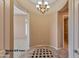 Elegant foyer with checkered floor and chandelier at 20621 N Canyon Whisper Dr, Surprise, AZ 85387