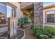 Front patio with fountain and lush landscaping at 20621 N Canyon Whisper Dr, Surprise, AZ 85387