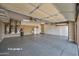 Three-car garage with ample storage and ceiling fans at 20621 N Canyon Whisper Dr, Surprise, AZ 85387