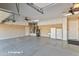 Three-car garage featuring overhead storage and a sink at 20621 N Canyon Whisper Dr, Surprise, AZ 85387