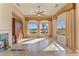 Bright great room featuring a fireplace and large windows at 20621 N Canyon Whisper Dr, Surprise, AZ 85387