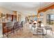 Open kitchen features dark wood cabinets, modern appliances, and a breakfast bar at 20621 N Canyon Whisper Dr, Surprise, AZ 85387