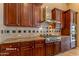 Well-equipped kitchen featuring gas cooktop and ample cabinetry at 20621 N Canyon Whisper Dr, Surprise, AZ 85387