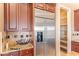 Updated kitchen with stainless steel refrigerator and pantry at 20621 N Canyon Whisper Dr, Surprise, AZ 85387
