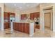 Modern kitchen with island and stainless steel appliances at 20621 N Canyon Whisper Dr, Surprise, AZ 85387