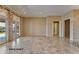 Large living room with tile floors and view to backyard at 20621 N Canyon Whisper Dr, Surprise, AZ 85387