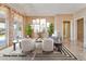 Elegant living room with staged furniture and natural light at 20621 N Canyon Whisper Dr, Surprise, AZ 85387