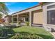 Spacious patio with a water feature and lush grass at 20621 N Canyon Whisper Dr, Surprise, AZ 85387