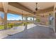 Spacious covered patio with golf course views at 20621 N Canyon Whisper Dr, Surprise, AZ 85387