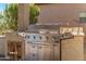 Outdoor kitchen area with a built-in grill at 20621 N Canyon Whisper Dr, Surprise, AZ 85387