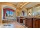 Primary bath with double vanity and a large soaking tub at 20621 N Canyon Whisper Dr, Surprise, AZ 85387