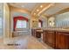 Spacious Primary bath with double vanity, soaking tub, and glass block accents at 20621 N Canyon Whisper Dr, Surprise, AZ 85387
