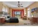 Spacious Primary bedroom with staged furniture and golf course view at 20621 N Canyon Whisper Dr, Surprise, AZ 85387
