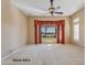 Bright Primary bedroom with golf course views and a ceiling fan at 20621 N Canyon Whisper Dr, Surprise, AZ 85387